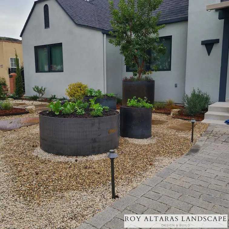 steel planters outside a home